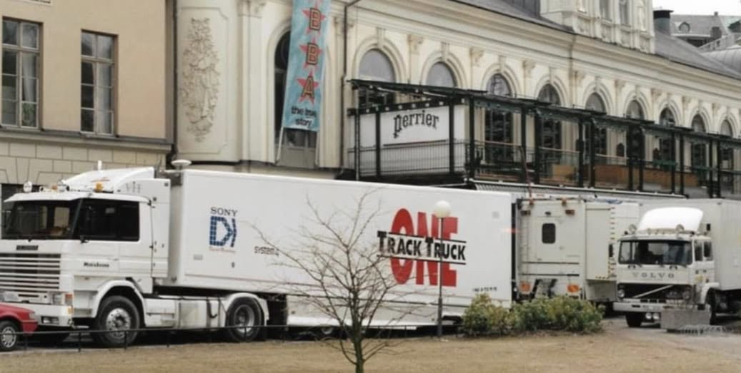 Soundtrack One mobile broadcasting truck with gold MediaSound branding on the open road