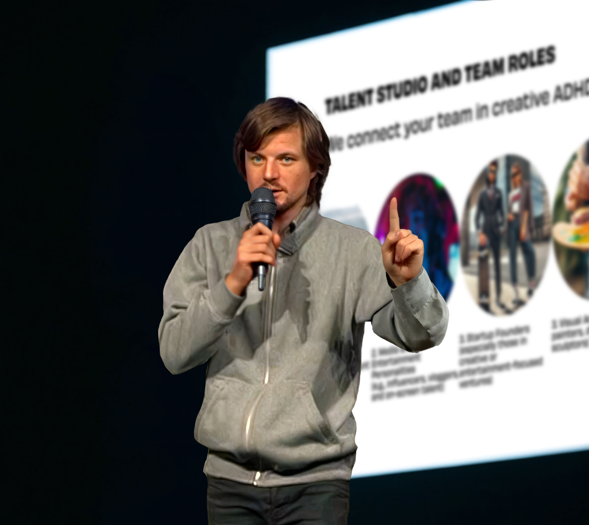 Michael Muhr speaking on stage in front of a Talent Studio and Team Roles slide